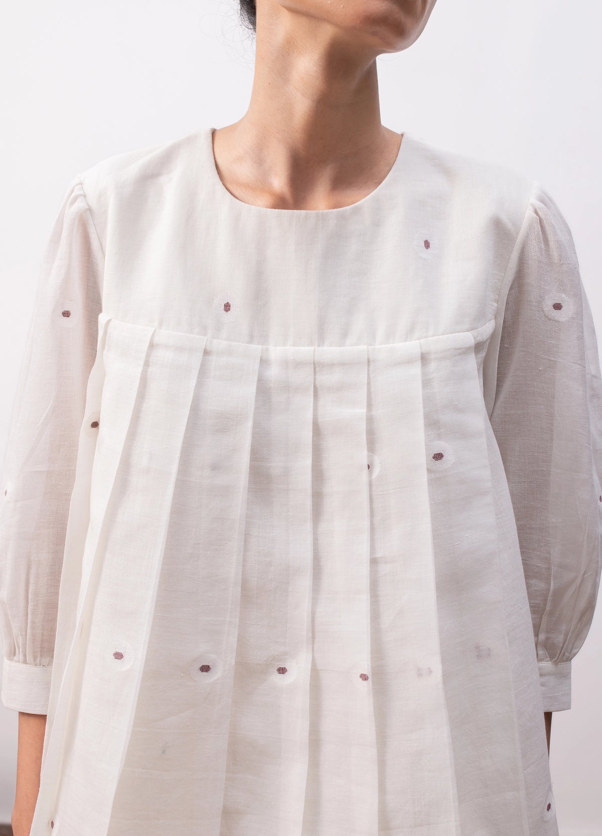 Soft white co-ord with relaxed pleated top and  flowy skirt - Hiranya