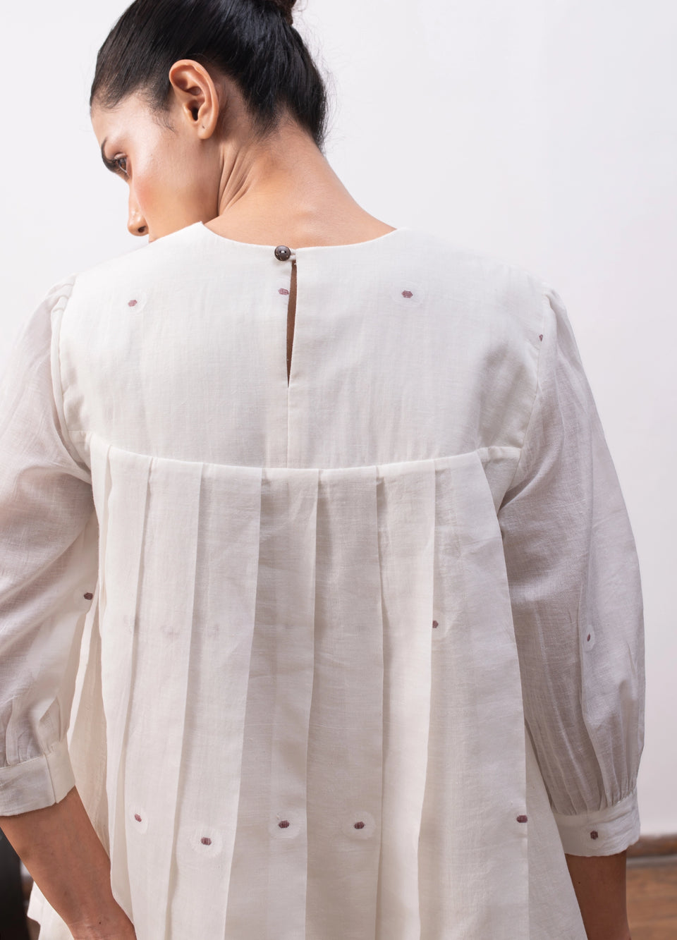 Soft white co-ord with relaxed pleated top and  flowy skirt - Hiranya