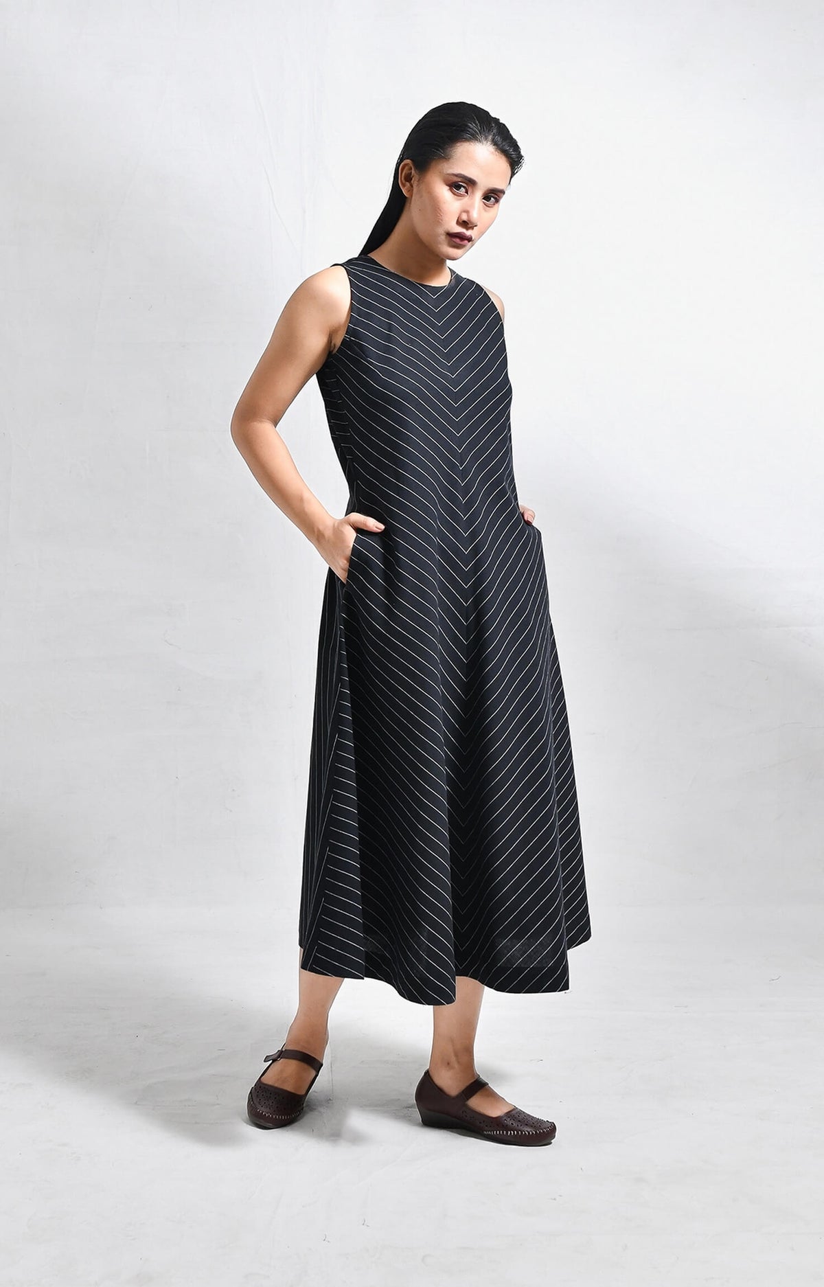 Pinstriped black cotton sleeveless A-line midi dress for women