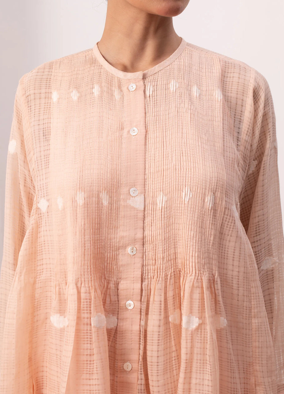 Peach midi dress with soft structure and flow - Hiranya