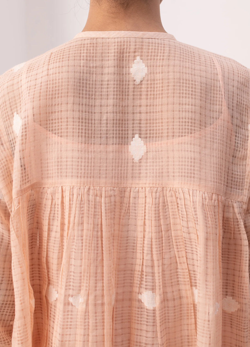 Peach midi dress with soft structure and flow - Hiranya